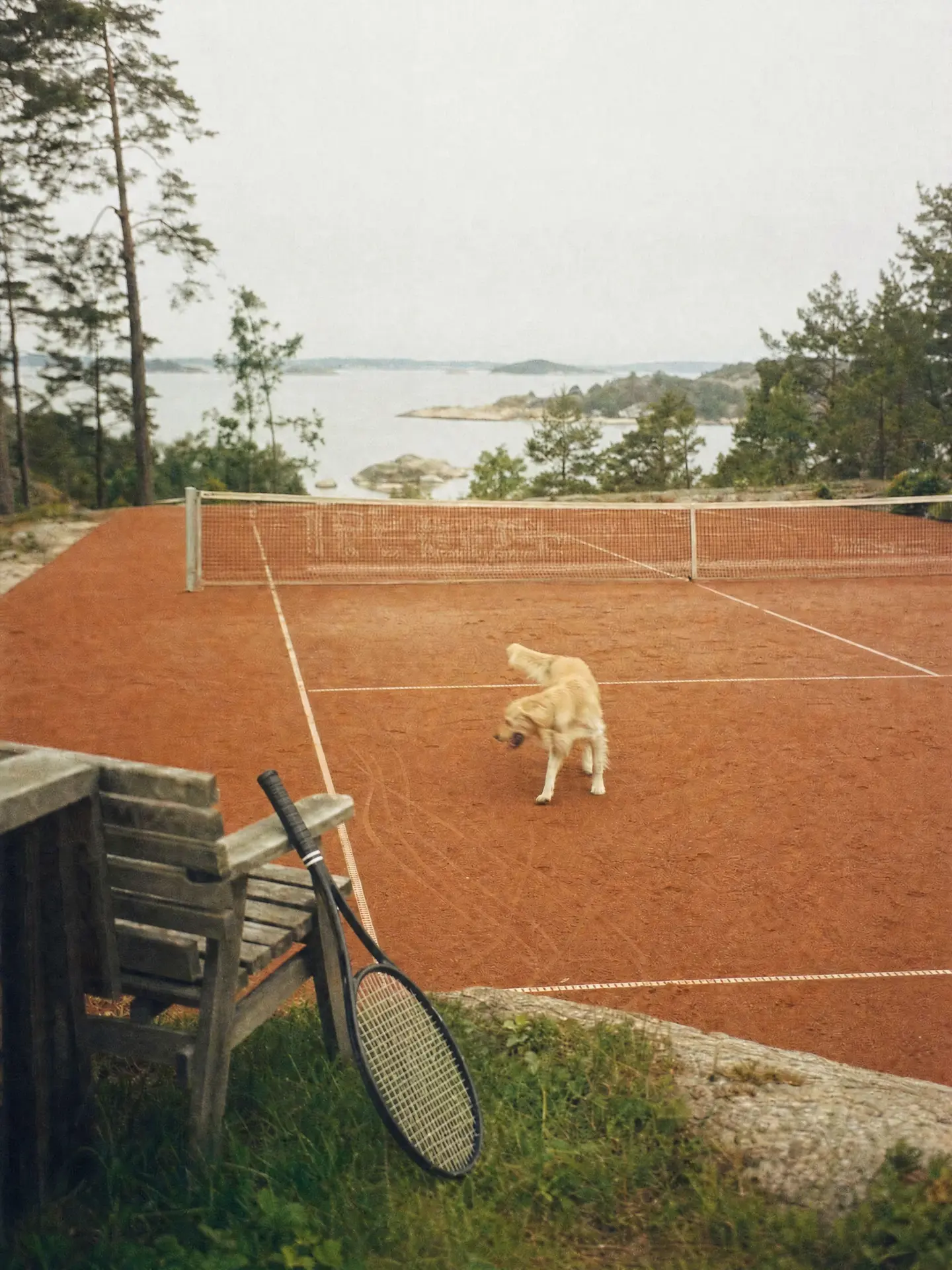 A tennis coach running an on-court lesson with a student